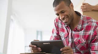 Let's Get Started! Picture of Man Holding Tablet