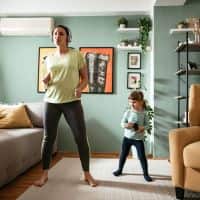 woman and child dancing with headphones