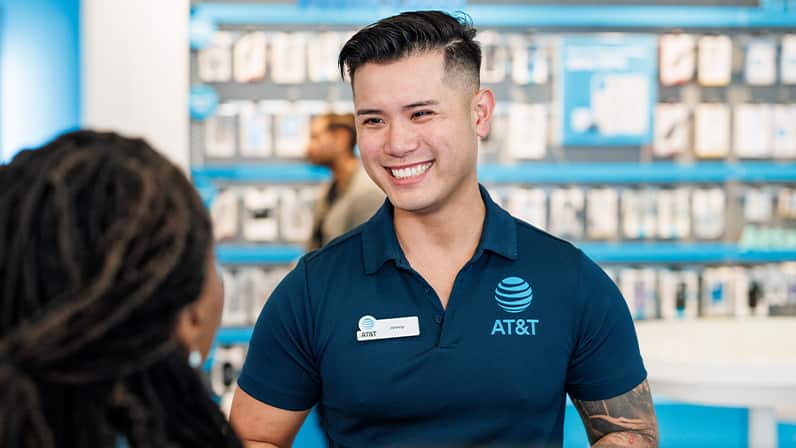 AT&T store employee talking to customer