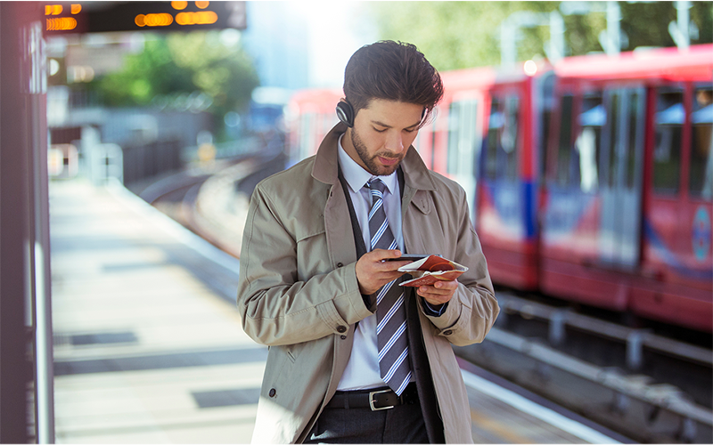 A man checking his tikcet in station