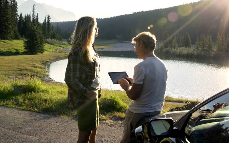 A boy and girl looking at tablet