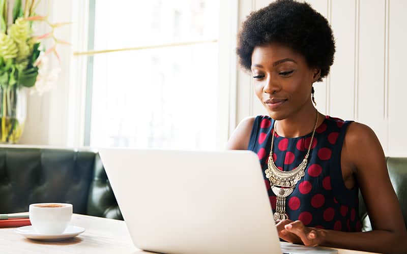 women typing in laptop