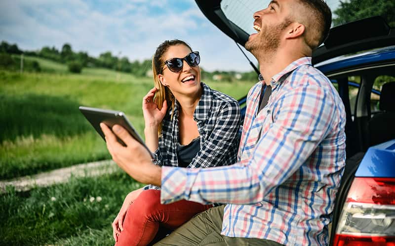 A boy and girl looking at tablet