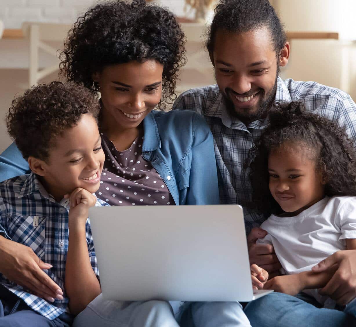 Family looking at their laptop