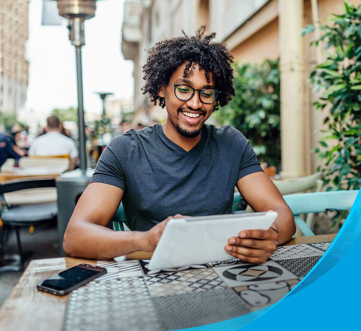 A man looking at his tablet
